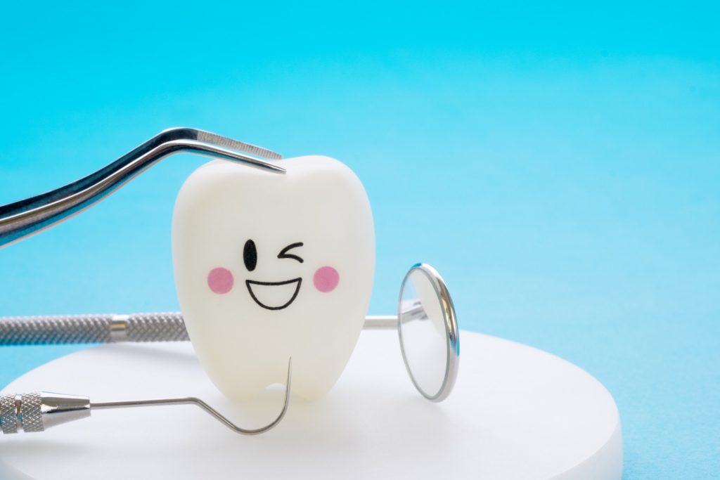 Dental tools and smile teeth model.